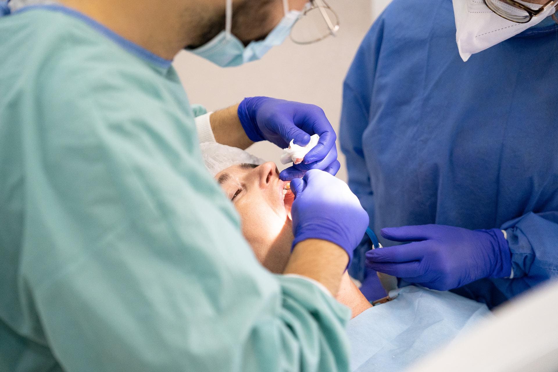 two dentists providing dental treatment for tooth loss
